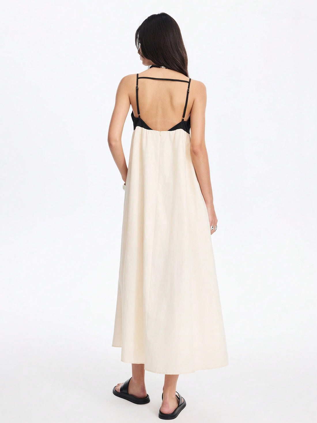 Step into sunshine with this effortlessly chic backless colorblocked maxi dress, designed to keep you cool and stylish all spring and summer. Its playful colorblocking adds a fun twist, while the backless design brings a breezy, vacation-ready vibe. Whether you're strolling the beach or running errands, this dress combines comfort and flair for everyday wear with a splash of adventure.