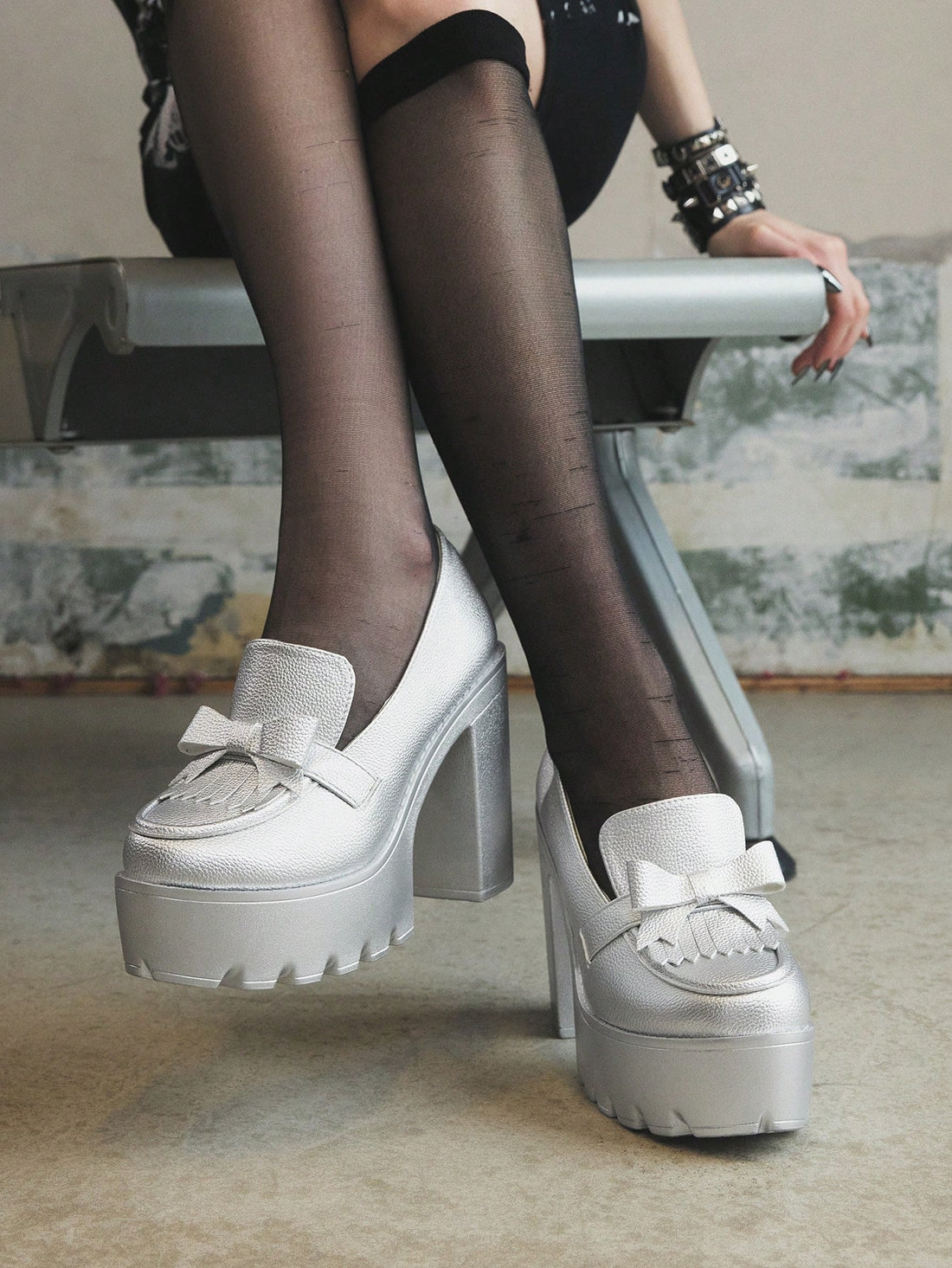 Step out in style with these Trendy Silver High Heel Slip-On Loafers! Featuring chunky heels and playful fringe details, these Mary Jane Oxfords add a fun twist to any outfit. Easy to slip on and designed for comfort, they’re perfect for turning heads wherever you go. Shine bright and dance through your day with a touch of silver sparkle!