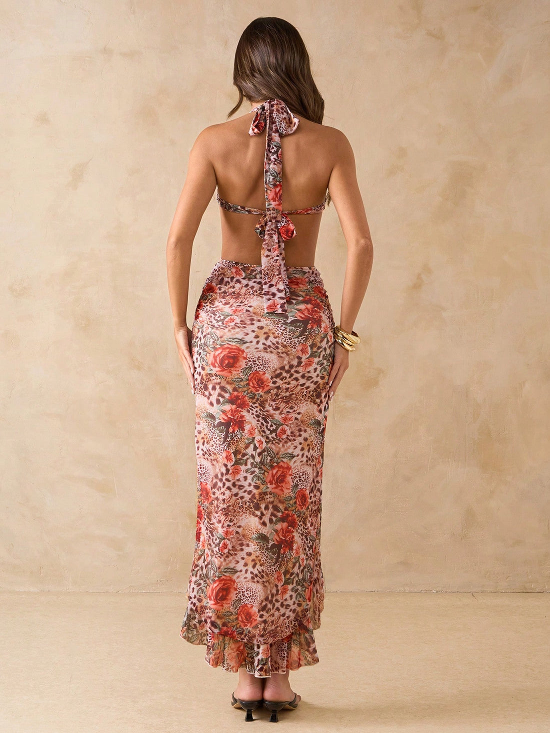 Make a statement in our fierce leopard print halter neck dress! This sassy number features a flirty high slit and playful ruffle hem that's ready to dance the night away. Perfect for turning heads at summer parties or strutting down beach boardwalks on vacation. Wild enough for adventures, stylish enough for cocktails!