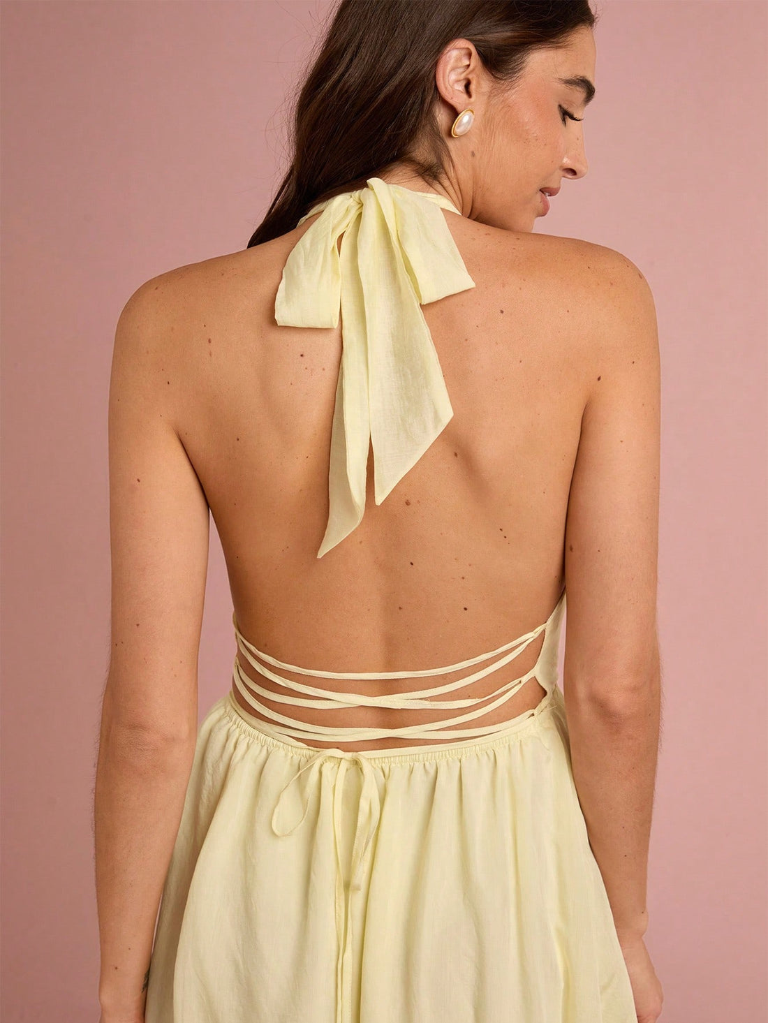Get ready to charm and turn heads with our Charming Pastel Yellow Backless Halter Maxi Dress! With its vibrant pastel yellow color, alluring backless design, and flirty halter neckline, this dress is perfect for any summer vacation, wedding, or party. Make a statement and stand out in this must-have dress.