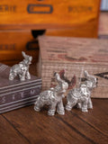 White silver elephant figurine set for holiday home decor