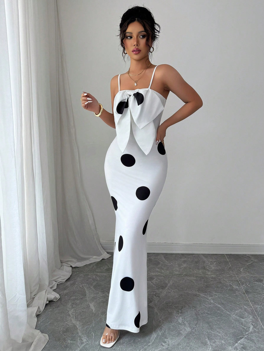 Step into sunny days with this playful summer dress featuring classic polka dots and flirty spaghetti straps. The charming bowknot detail adds a sweet touch, making it perfect for casual outings or garden parties. Lightweight and breezy, it keeps you cool while turning heads wherever you go.