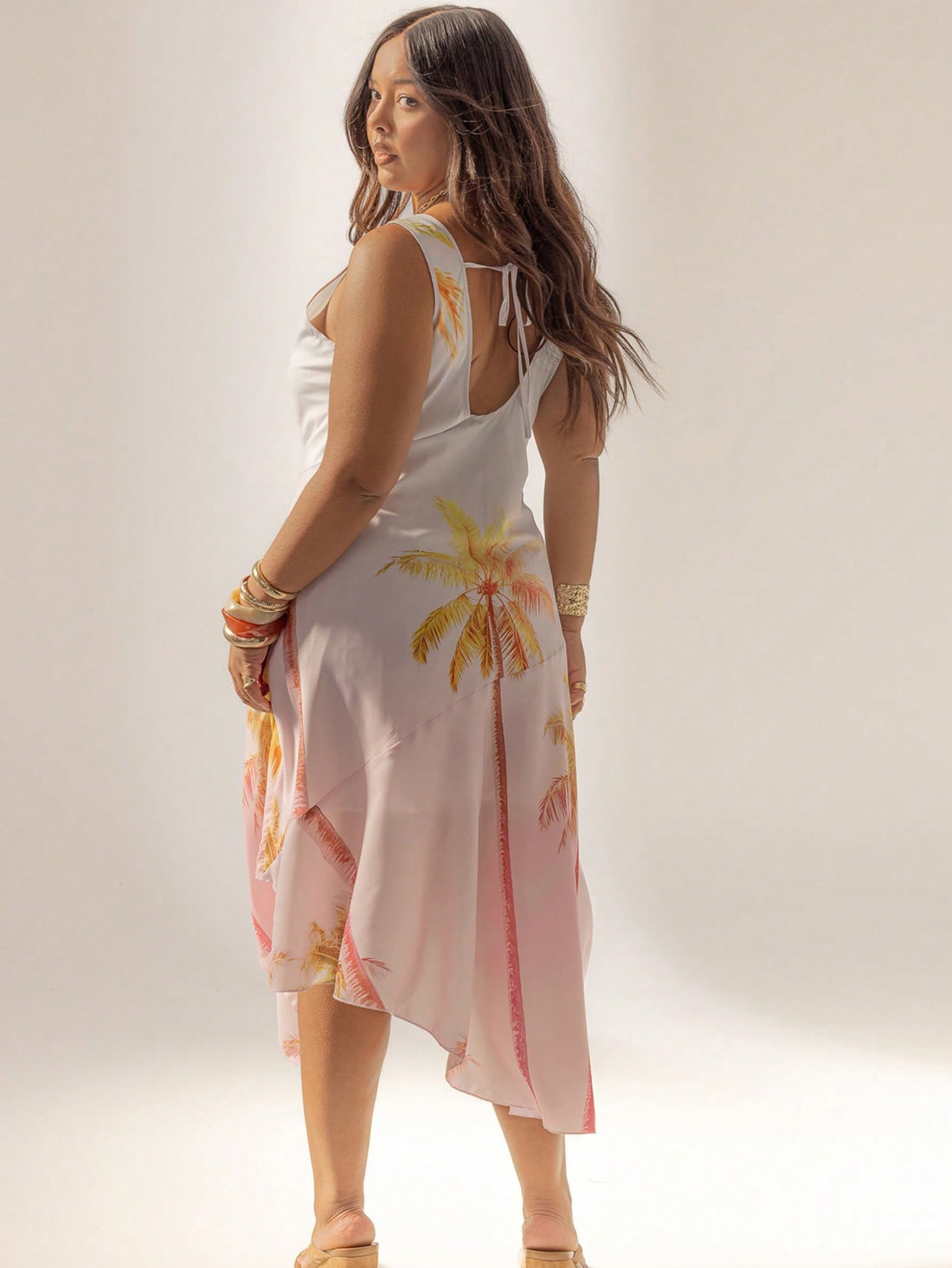 Turn heads on your beach getaway with this Curve Cowl Neck Maxi Dress. Its playful asymmetrical hem flows beautifully with every breeze, while the cowl neck adds a flirty touch. Easy to dress up or down, it’s the perfect companion for sunny days and balmy nights by the shore. Comfortable, stylish, and effortlessly chic—your new vacation favorite awaits!