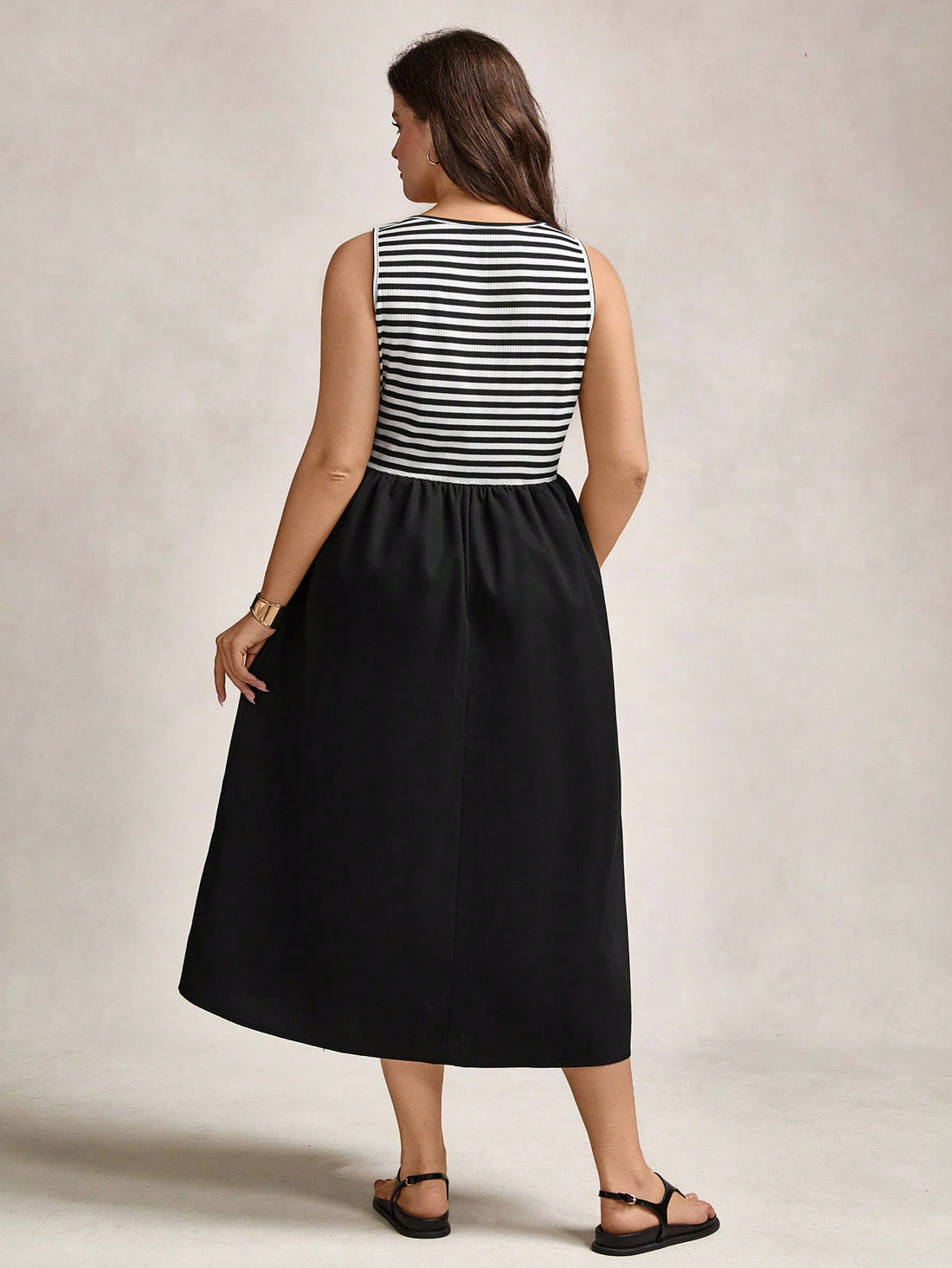 Step into summer with this chic plus size dress, perfect for vacation vibes or graduation day glam. Available in timeless navy and sleek black, it effortlessly combines comfort with style. Flowy and flattering, it’s your go-to for sunny strolls or celebrating life’s big moments with a splash of confidence and charm.