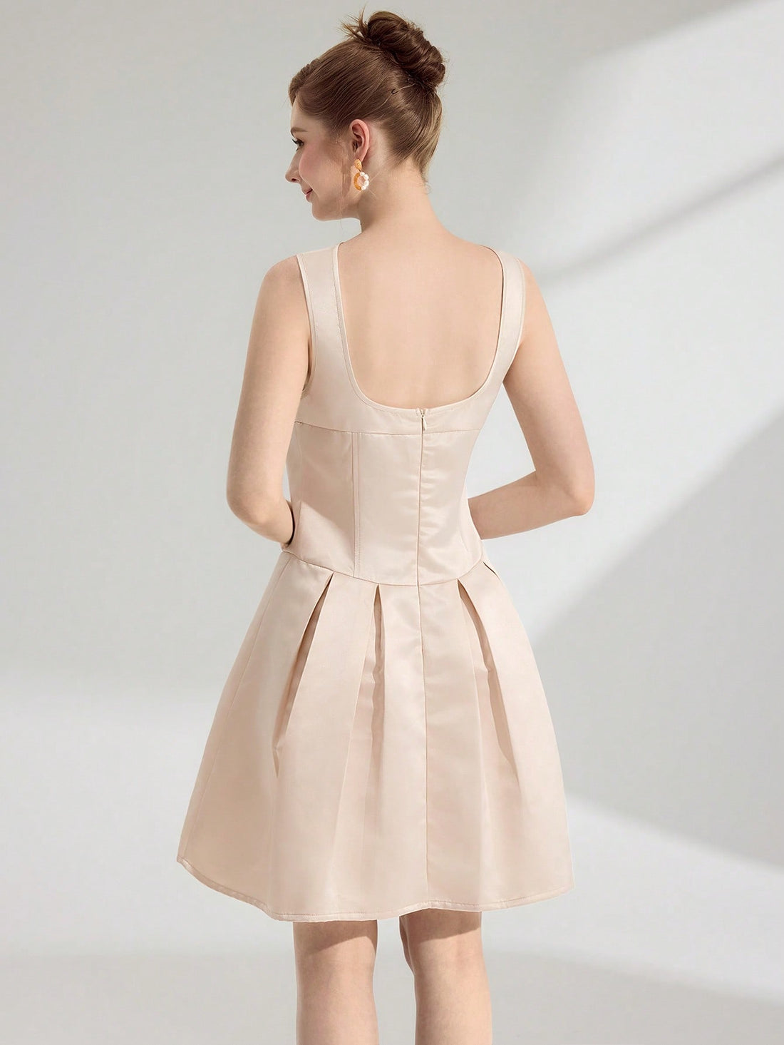 Make a statement at your next special occasion in this charming sleeveless mini dress! Featuring an eye-catching bow detail at the neckline, this piece effortlessly transitions from prom to garden parties to summer celebrations. The clean, minimalist silhouette flatters every figure, while the playful bow adds just the right touch of personality. Pair it with heels and a clutch for an unforgettable night out. Perfect for anyone who loves turning heads with timeless elegance and a hint of fun!