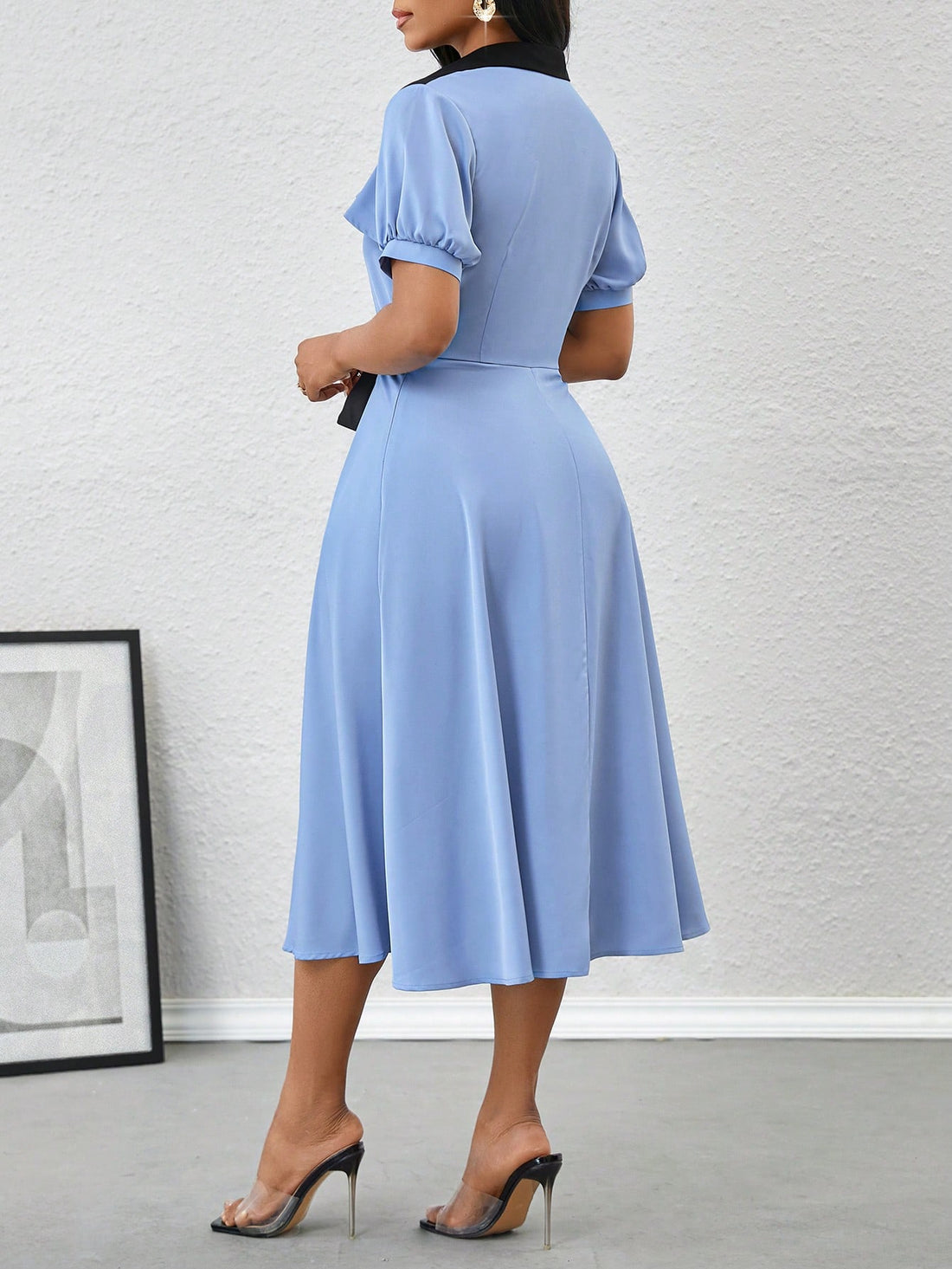 Brighten up your wardrobe with our Elegant Color Block Midi Dress. Featuring playful puff sleeves and a stylish collar, this dress effortlessly combines sophistication and fun. The color block design adds a unique touch, making you stand out from the crowd. Perfect for confident and stylish women.