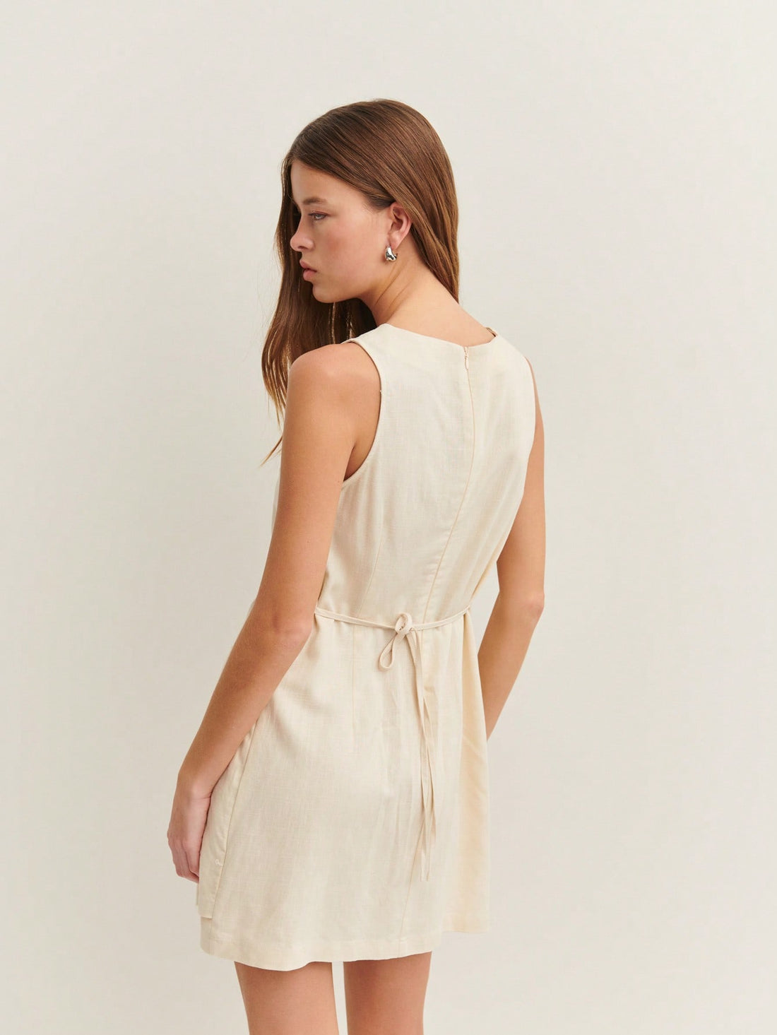 Beat the heat without compromising on polish! The N-ista Sleeveless Dress brings breezy comfort to your workday wardrobe with its chic, armhole design that keeps you cool when temperatures climb. Sophisticated skirt detailing adds an unexpected touch of elegance, transforming this piece from basic to boardroom-ready. Perfect for those days when you want to look effortlessly put-together while staying refreshingly comfortable. Your summer office game just got a serious upgrade!