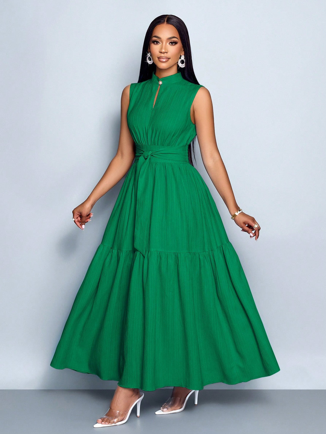 Elevate your style game with this playful blue sleeveless dress! The stand collar adds a touch of sophistication, while the cinched waist and tie knot detail create a flattering silhouette that's sure to turn heads. Perfect for sunny days, special occasions, or whenever you want to feel fabulous without trying too hard!