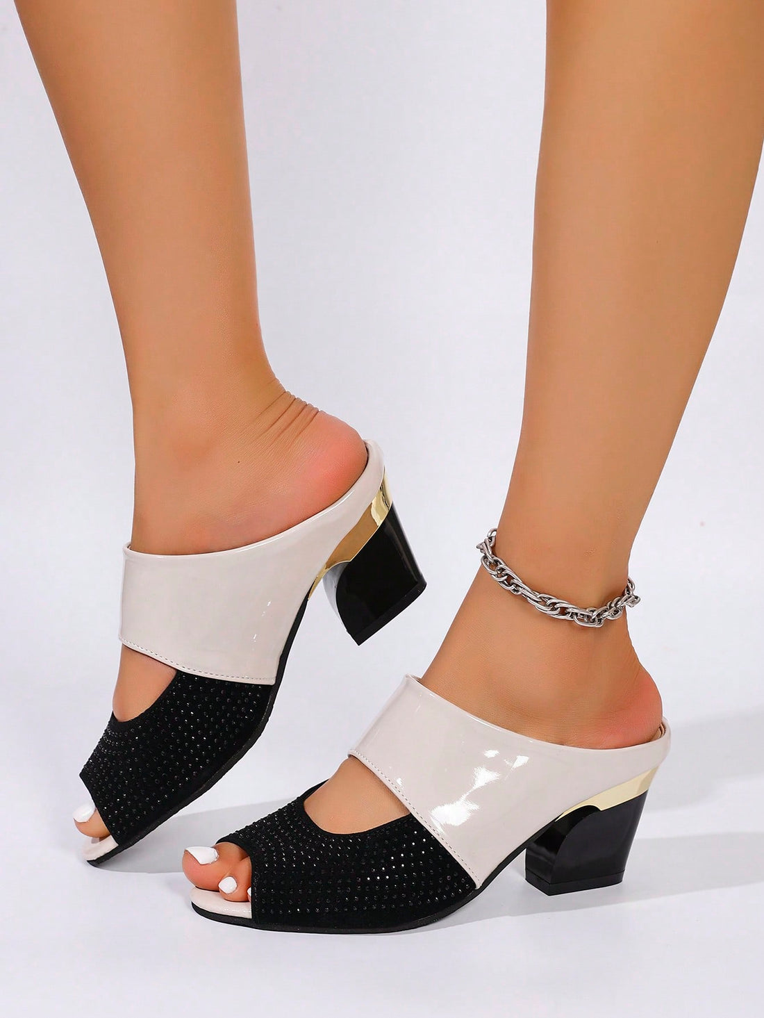 Step out in sparkle with these Elegant Rhinestone Peep-Toe High Heeled Sandals! Perfect for any season, their versatile slide design offers comfort without sacrificing style. Whether you're dancing the night away or adding a touch of glam to your day, these heels bring a playful shine to every step.