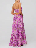 Back view of purple floral maxi dress with open back and tiered ruffle hem