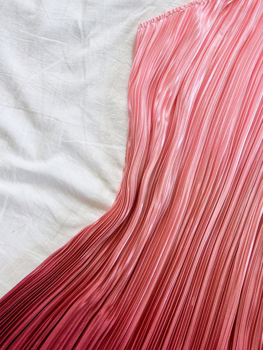 Elevate your warm-weather wardrobe with this stunning blue ombre pleated mini dress. Featuring a flattering halter neckline and high-waisted A-line silhouette, this sleeveless cami-style dress transitions effortlessly from beach days to festival nights. The all-over print design and flared hem create movement and visual interest, while the slim fit offers a polished look. Crafted from 100% polyester knitted fabric with a semi-sheer finish, this unlined piece is easy to care for with simple machine washing. 