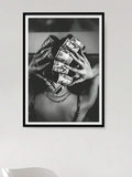 Black and white woman holding rolled dollar bills in framed wall art