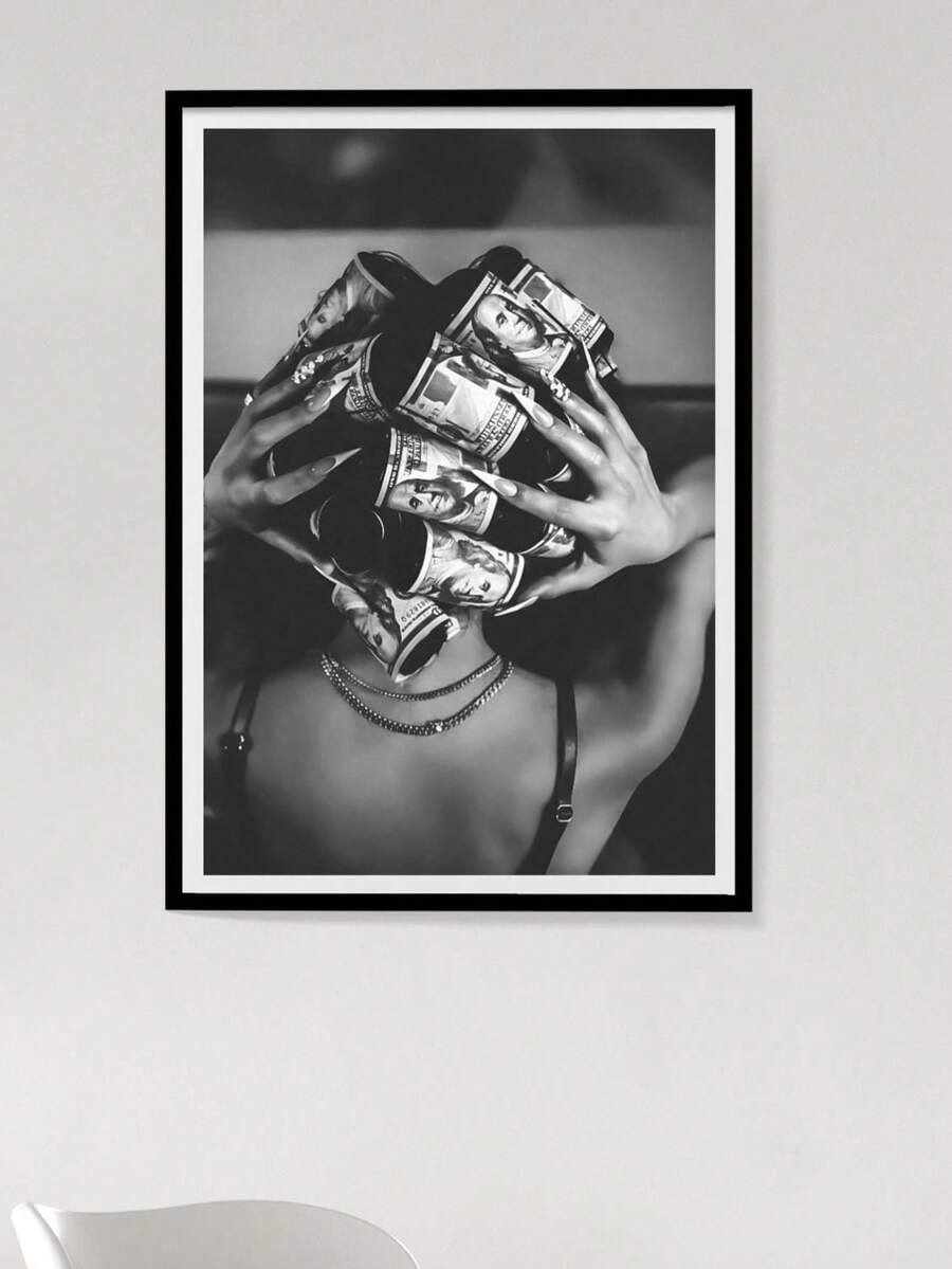 Black and white woman holding rolled dollar bills in framed wall art
