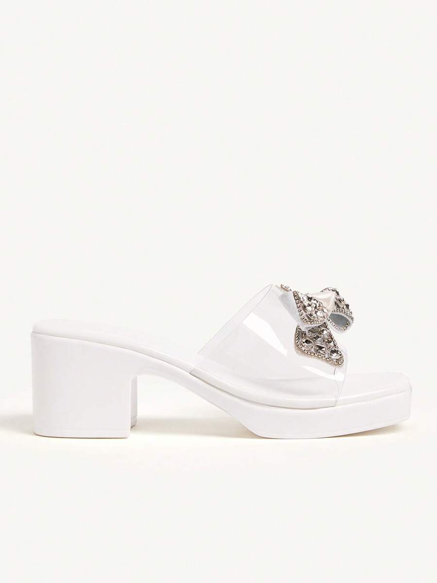 Step into summer with these Elegant Rhinestone Bow Knot High Wedge Sandals! Sparkling rhinestones and a charming bow knot add a playful touch to your beach days and sunny outings. The high wedge design offers stylish height and comfortable support, perfect for dancing through warm evenings or strolling along the shore. Elevate your summer wardrobe with these dazzling, fun sandals made to shine wherever you go.