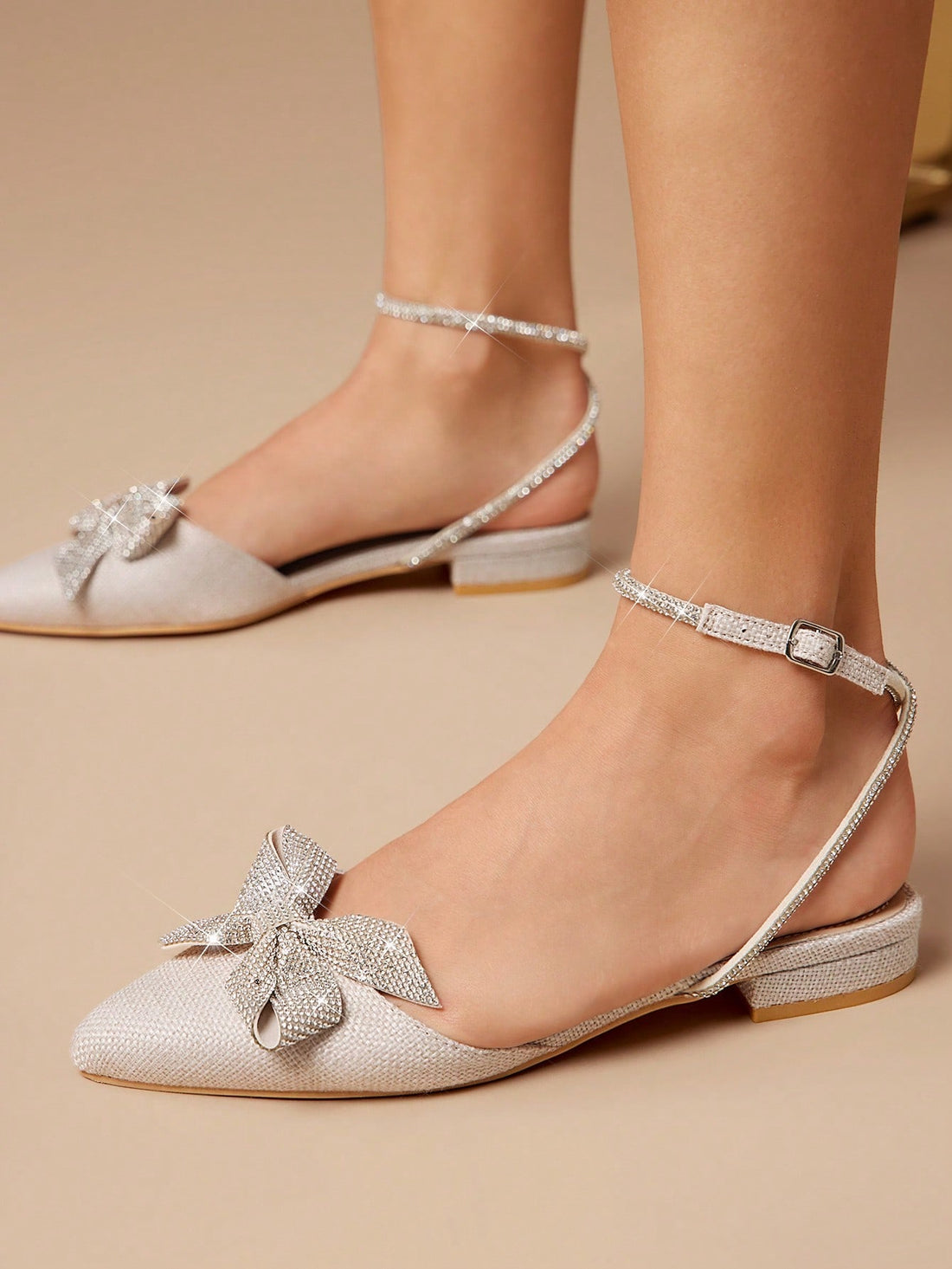 Step out in style with these Elegant Rhinestone Bow Ankle Strap Ballet Flats! Featuring a chic almond toe and sparkling rhinestone bow, they add a touch of glam to any outfit. The ankle strap keeps them snug and comfy, perfect for dancing through your day with a playful bounce.