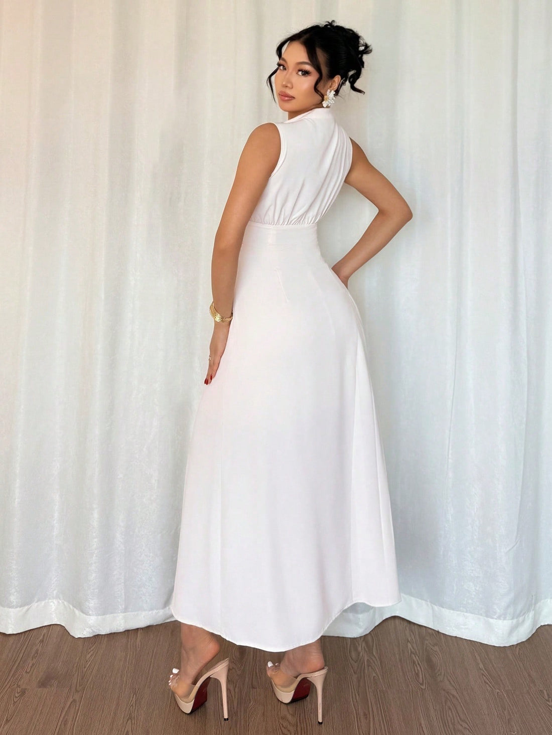 Slip into effortless summer elegance with this apricot sleeveless dress that's equal parts chic and comfortable. The tie-waist cinches your silhouette while delicate pleats add movement and dimension, creating a flattering slim fit that works for everything from brunch dates to casual outings. The warm apricot hue brings a fresh, sun-kissed glow to your wardrobe. Pair it with sandals for laid-back vibes or dress it up with heels for a night out. This versatile piece is your new go-to for looking polished wi