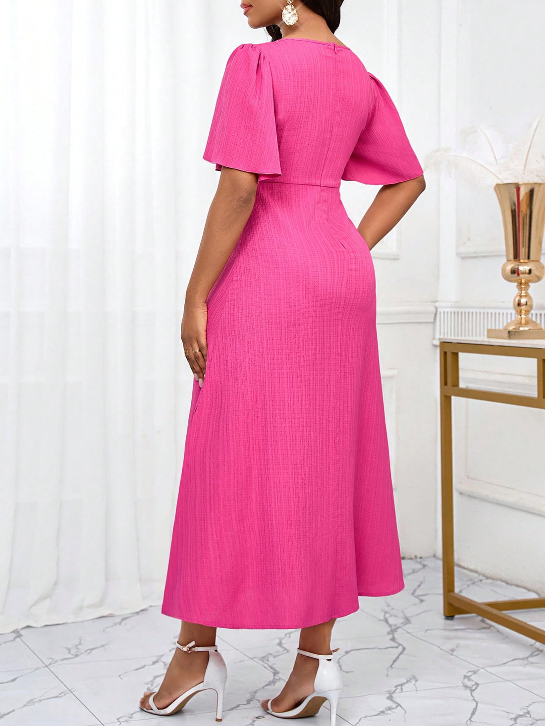 Introducing our perfect summer style, the Elegant Solid Color Textured Twist Front Long Dress for Women. With its unique twist front design and comfortable, textured fabric, this dress is both elegant and practical. Elevate your summer wardrobe with this must-have dress.