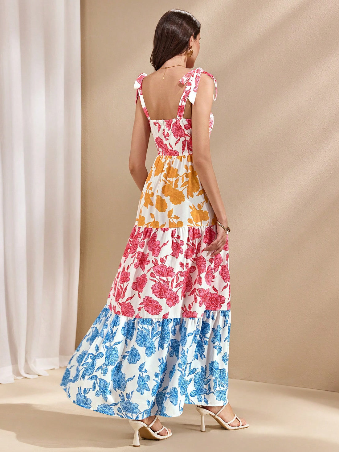 Escape to paradise in this charming floral patchwork dress that's practically begging for a vacation! Featuring a playful tiered hem that dances with every step, this piece combines romantic florals with modern patchwork details for effortless summer style. Perfect for beach getaways, garden parties, or lazy afternoons exploring new destinations. The flowing silhouette keeps you cool and comfortable while the mixed prints add personality and flair. Whether you're sipping cocktails by the pool or strolling t