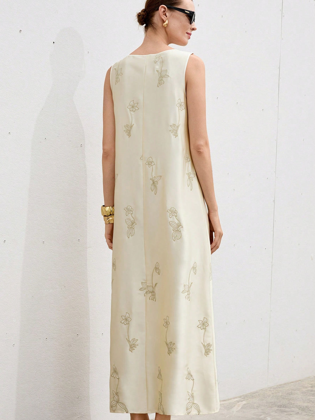 Turn heads with this Elegant Beige Satin Bodycon Dress, featuring delicate floral embroidery and a flattering U-neck. Its sleeveless design keeps things breezy, while the smooth satin fabric hugs your curves for a chic, confident look. Perfect for parties or a night out when you want to feel effortlessly fabulous!