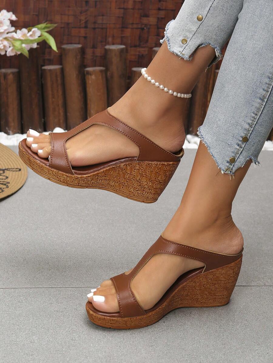 Step out in style with these Elegant Women's Platform Slide Sandals! Featuring a high wedge and open toe design, they add a fun lift to any outfit while keeping you steady with a non-slip sole. Perfect for sunny days and outdoor adventures, these slides blend comfort and fashion effortlessly. Get ready to turn heads and enjoy every step with a playful bounce!