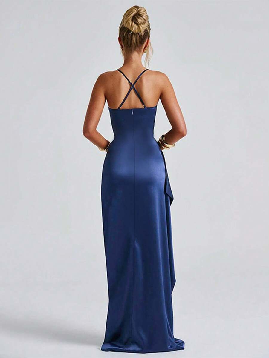 Navy satin gown back view showing crossed spaghetti straps and full-length skirt