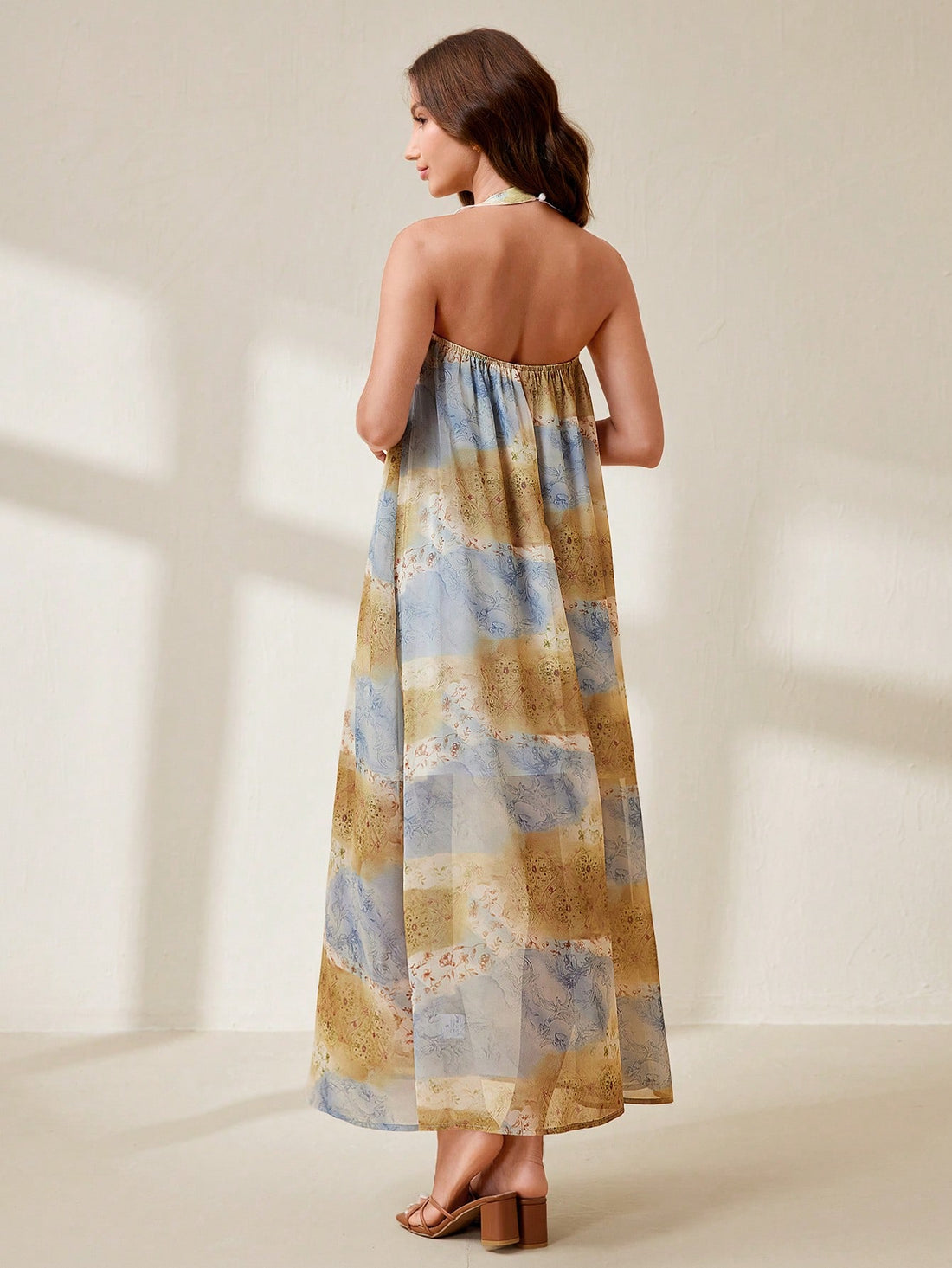 Sway to the rhythm of summer in our Bohemian Tropical Print Halter Beach Dress! This free-spirited beauty lets you dance between beach waves and beachside cafés with breezy confidence. The playful tropical pattern and loose-fitting design keep you cool while turning heads. Perfect for tossing over your swimsuit or pairing with sandals for an instant vacation vibe – wherever your sun-soaked adventures take you!