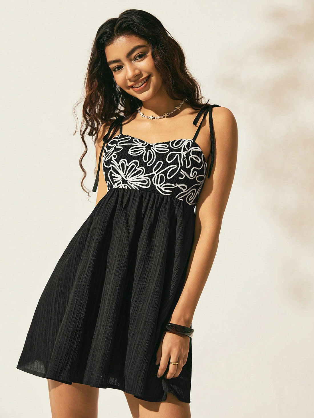 Embrace carefree vibes with this Bohemian Black Loose Strap Dress, your go-to for sunny seaside escapes. Its breezy, relaxed fit keeps you cool while the sleek black hue adds a touch of effortless chic. Perfect for spring and summer adventures, this dress lets you dance with the ocean breeze in style and comfort.
