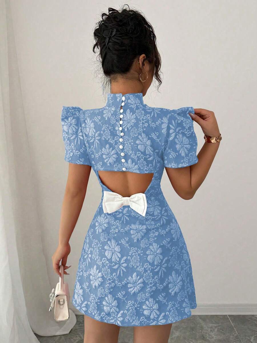 Step into summer with this playful vintage-inspired green mini dress. Featuring charming puff sleeves and a high neck, it balances sweet with sophistication. The backless design adds a flirty twist, perfect for sunny days and warm nights. Light, fun, and effortlessly stylish—this dress invites you to twirl, dance, and shine wherever you go.