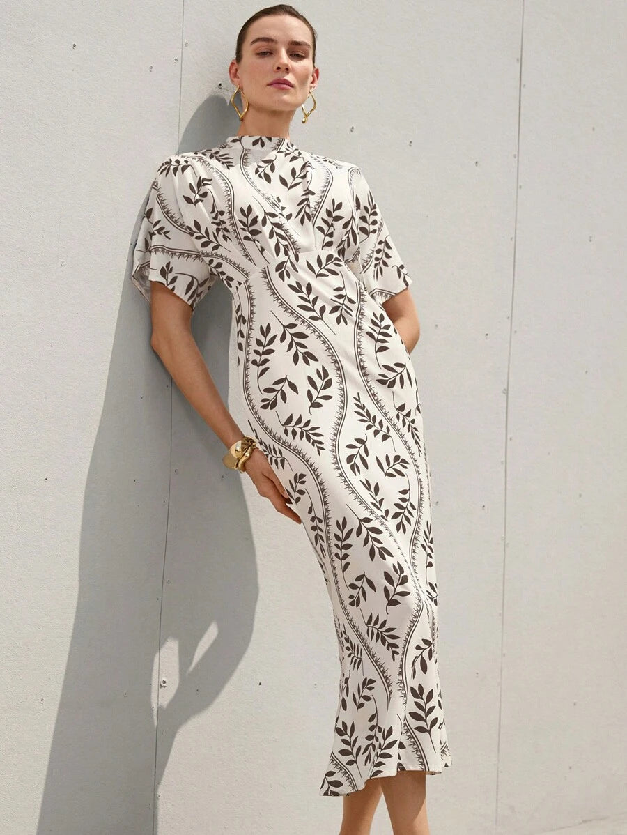 Step into effortless charm with this Elegant French Romantic Women’s Dress. Featuring a flirty high neckline and a stylish colorblock design, it cinches at the waist to highlight your silhouette. The playful fish tail hem adds a whimsical touch, perfect for twirling through your day or night. Embrace your inner romance with a dress that's as fun as it is flattering.