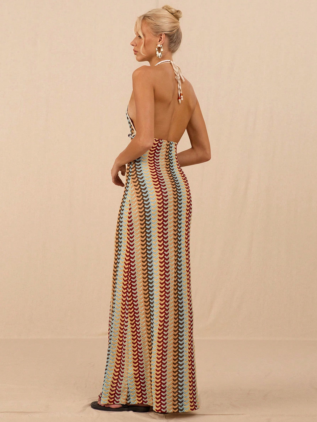 Turn heads this summer with our Stylish V-Neck Halter Tie-Dye Crochet Beach Dress. Its playful tie-dye pattern and breezy crochet design keep you cool and chic by the shore. The flattering V-neck and adjustable halter tie ensure a perfect fit for sunny days and beachside fun. Embrace effortless style and make every beach outing your runway!