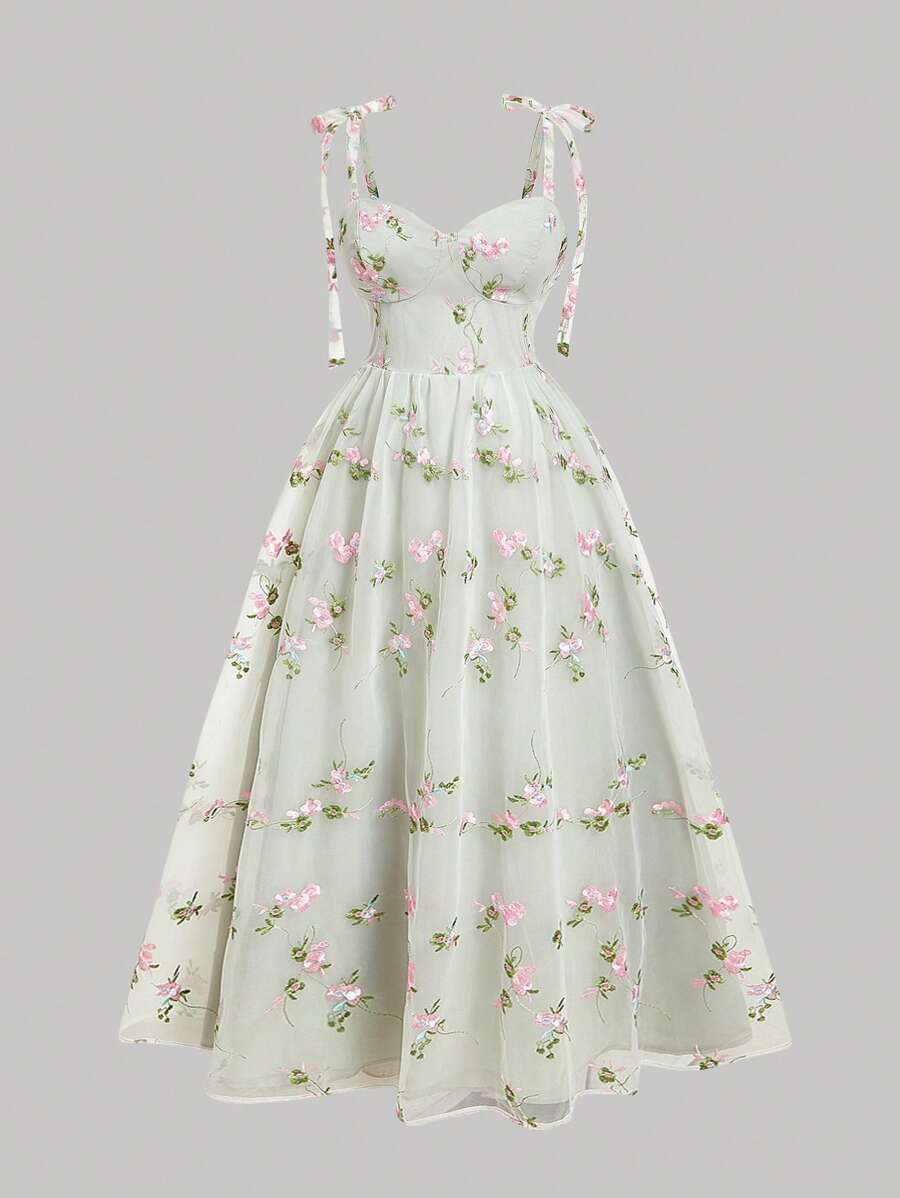 Front catalog view of ivory floral embroidered mesh sundress with tie straps and flared skirt