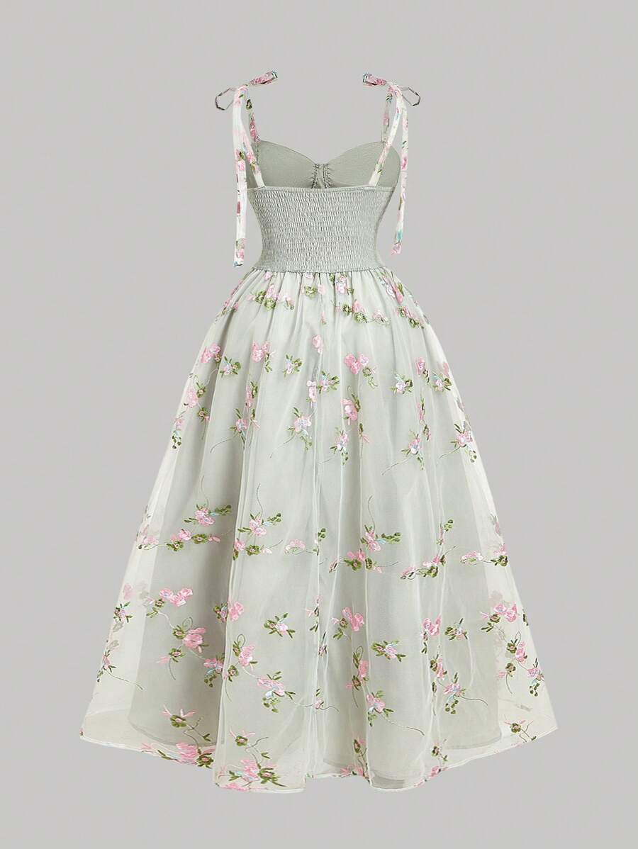 Front catalog view of ivory floral embroidered mesh sundress with tie straps and flared skirt