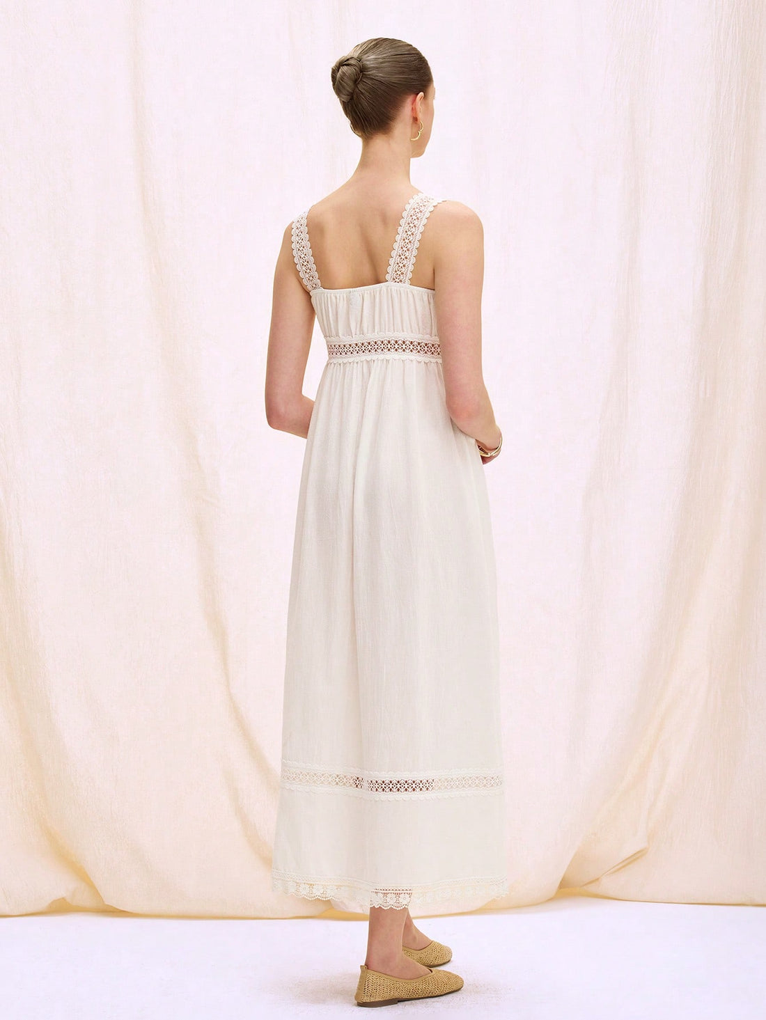 Step into sunshine with this playful sleeveless dress featuring delicate hollow lace patchwork. Its breezy design keeps you cool and stylish, making it the perfect companion for beach holidays and sunny adventures. Embrace effortless elegance and let your summer glow shine through every stitch.