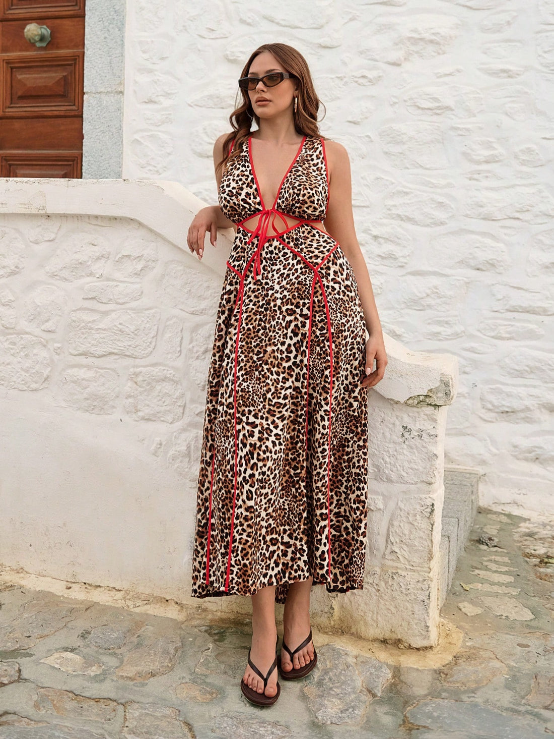 Turn heads this summer with our playful plus size red leopard print dress! Its sleeveless cut keeps you cool, while the back tie adds a flirty touch. Perfect for beach days or resort escapes, this dress combines bold style with effortless comfort. Embrace your wild side and make every getaway unforgettable.