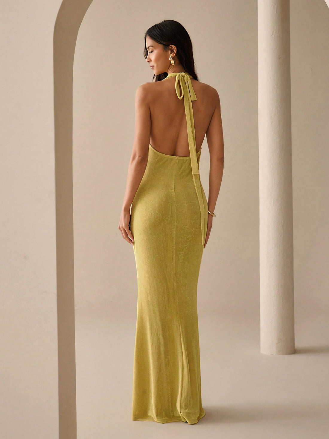 Brighten your wardrobe with this playful butter yellow dress, designed to keep you cool and stylish all summer long. Its sleeveless cut and tie-neck detail add a flirty touch, making it perfect for lively parties or casual days out. Lightweight and breezy, this dress effortlessly blends comfort with charm for your sunny adventures.