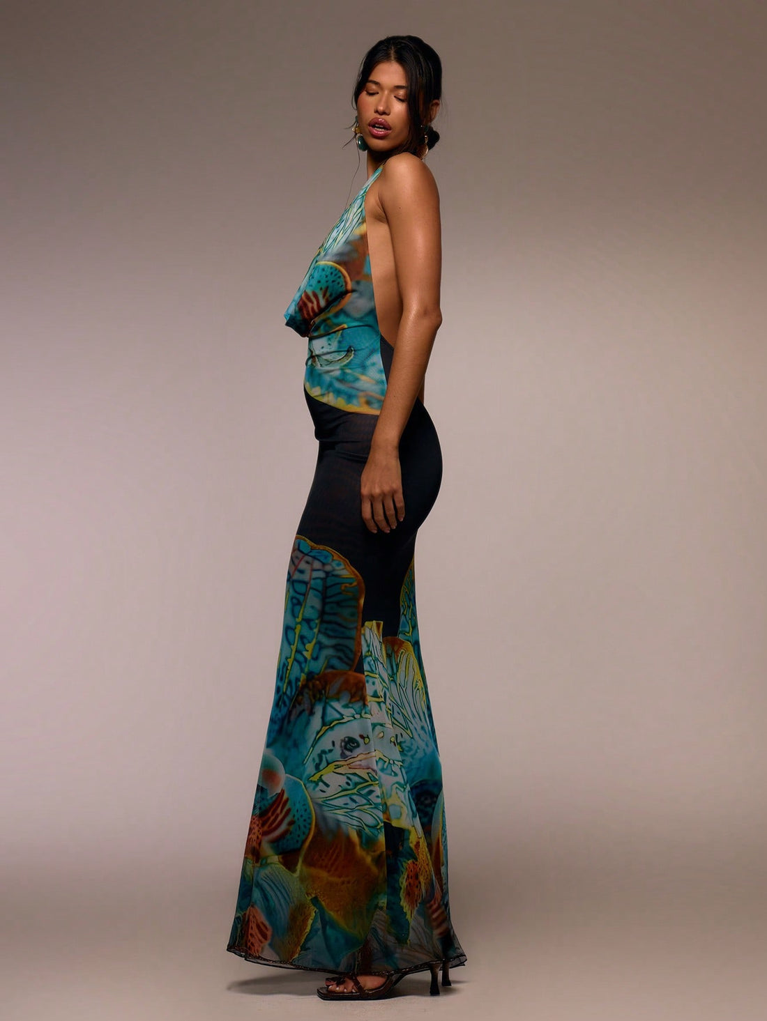 Step into sunshine and style with this Floral Maxi Dress featuring a flirty halter cowl neck. Its flowing silhouette and vibrant floral print make it your go-to for breezy spring days, lively summer festivals, or those effortless elegant moments on vacation. Lightweight and playful, it moves with you to keep the fun going from dawn to dusk. Embrace easy glamour and feel fabulous wherever your adventures take you!