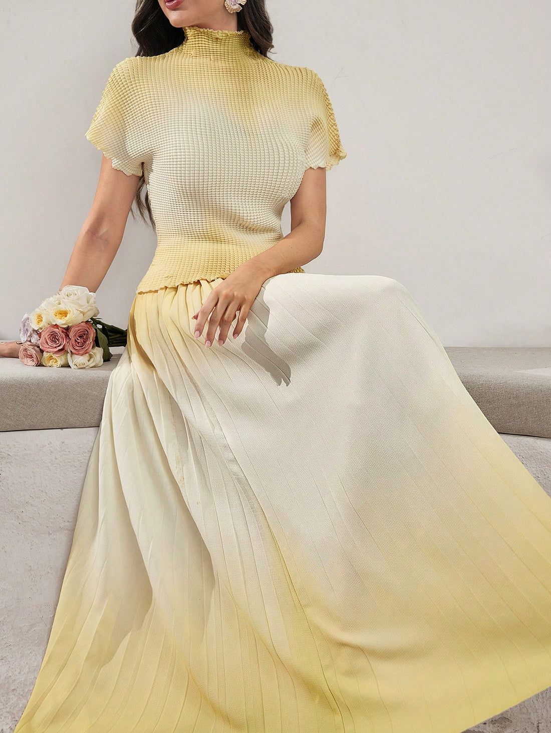 Elevate your wardrobe with this stunning ombre pleated set that effortlessly transitions from day to night. The soft gradient coloring flows beautifully across both the top and skirt, creating a cohesive, polished look without the fuss. Perfectly pleated for movement and comfort, this two-piece wonder pairs sophistication with playful charm. Whether you're heading to brunch or a casual evening out, this set delivers instant style that feels both put-together and refreshingly relaxed. No styling stress requi