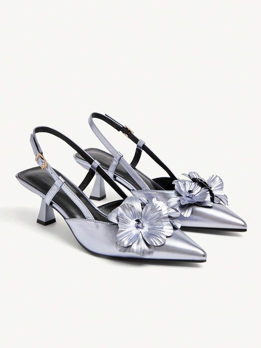 Step into elegance with these stunning floral embellished pumps that turn heads at every occasion. The delicate pointed toe and mid-height stiletto heel strike the perfect balance between sophisticated and comfortable, making them ideal for romantic dinners, parties, and special nights out. Intricate floral details add a touch of whimsy and charm, while the sleek silhouette flatters any outfit. Whether you're dancing the night away or making a grand entrance, these pumps deliver the glamour and confidence y