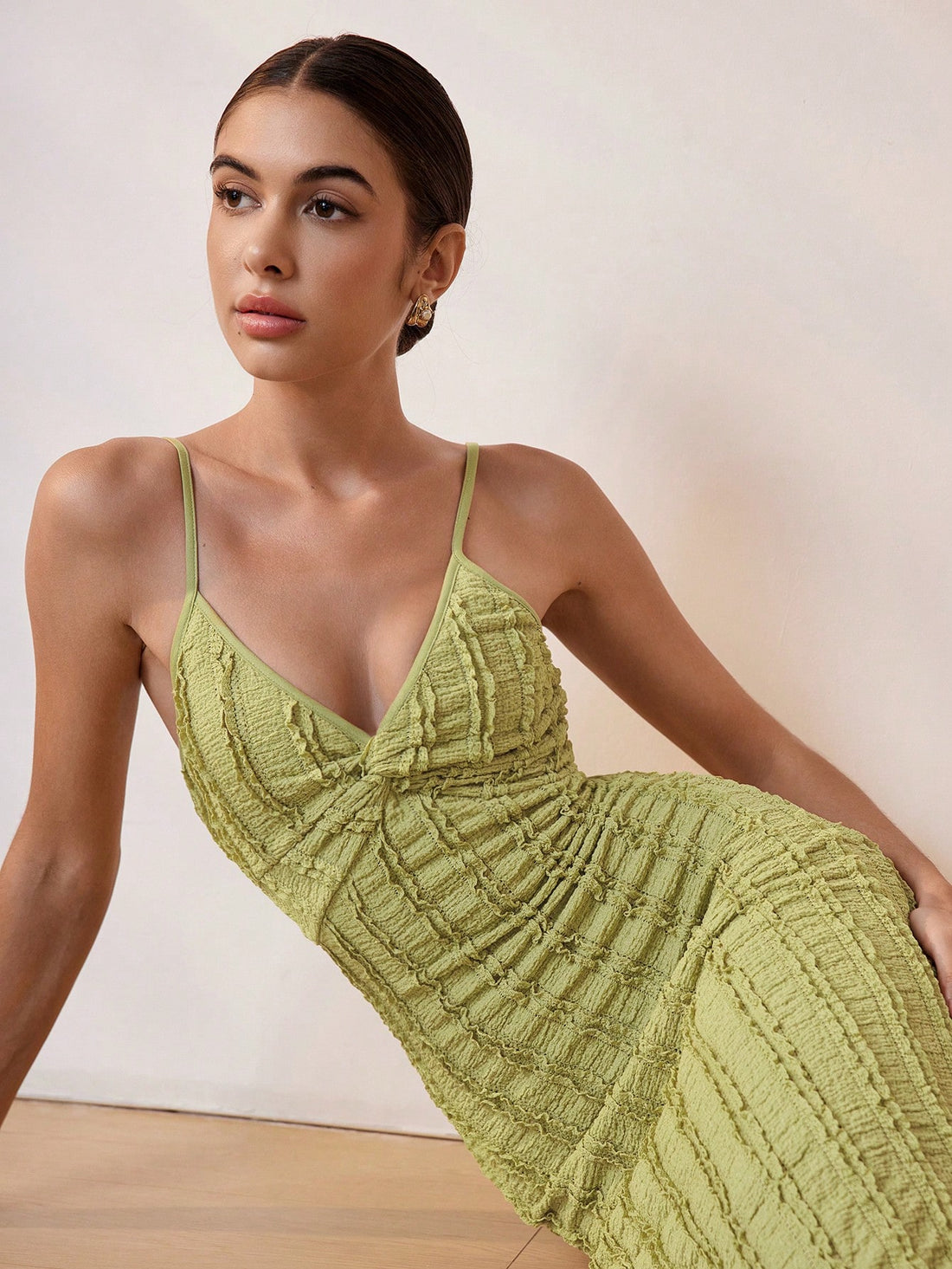 Crafted from premium knitted fabric, this maxi dress combines sophisticated design with effortless wearability. The slim silhouette flatters your figure while the distinctive twist strap detail adds visual interest and ensures comfortable, secure support. Perfect for summer getaways, beach resorts, or elegant evening occasions, this dress transitions seamlessly from day to night. The flowing maxi length provides graceful movement and timeless appeal. An essential piece for any vacation wardrobe, offering bo