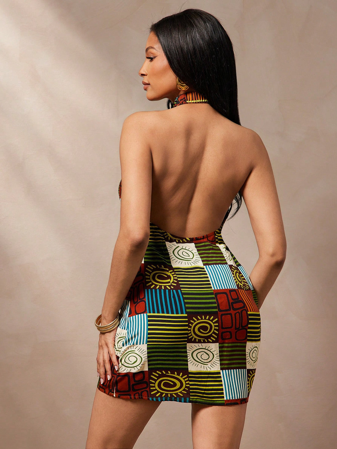 Embrace sunny days in this playful Boho Print Halter Neck Dress, designed with an open back and a breezy short length. Perfect for beach vacations, it combines comfort and style effortlessly, letting you dance through summer with ease and flair.