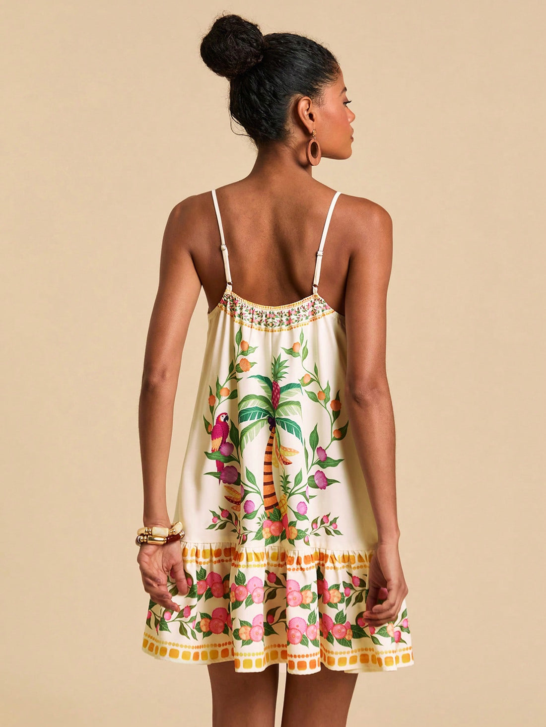 Embrace sunny vibes with this chic tropical print slip dress, designed to keep you cool and stylish all summer long. Its lightweight fabric and flattering cut make it ideal for beach days or dancing at festivals. Effortlessly playful and breezy, this dress is your go-to for warm-weather fun.