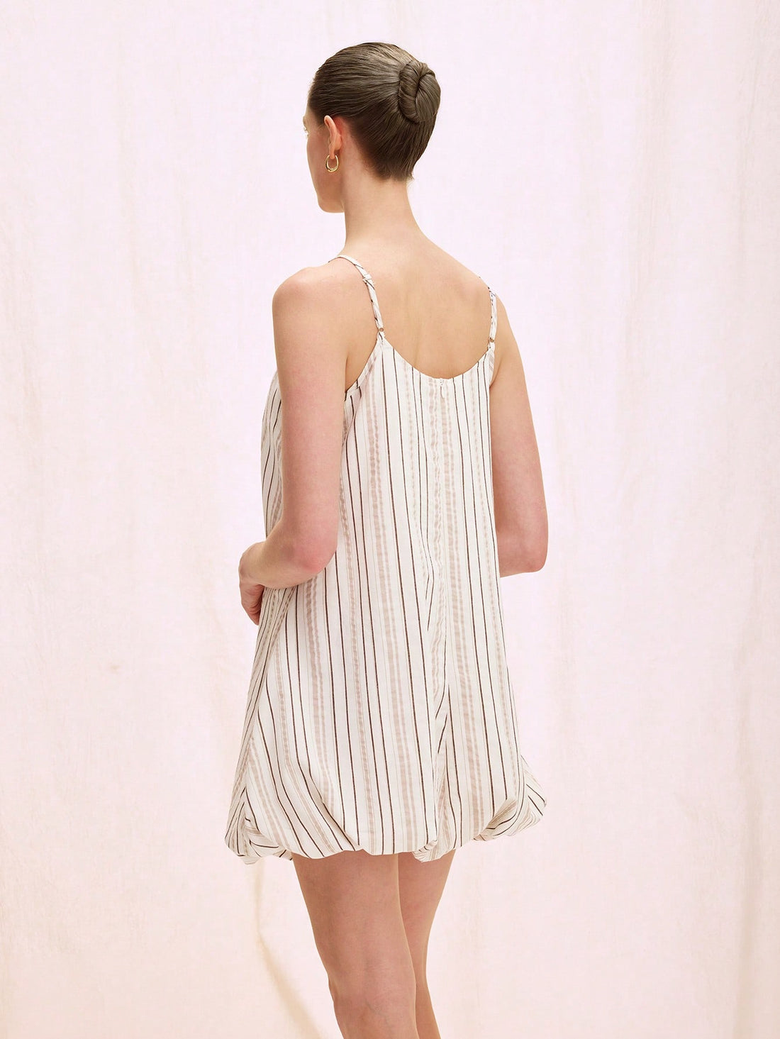 Step into sunshine with this playful midi dress featuring charming stripes and delicate floral patterns. Adjustable spaghetti straps let you find the perfect fit, while the flowing silhouette keeps you twirling through any occasion with ease and style. Perfect for brunch dates or garden parties, this dress brings a fresh, fun vibe to your wardrobe.