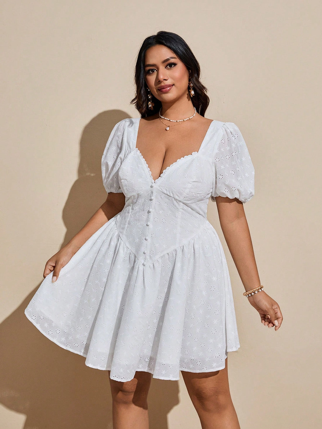 Step into vacation mode with this playful plus size mini dress featuring charming embroidered details and trendy puff sleeves. Its flattering silhouette and breezy fabric make it perfect for casual outings or sunny getaways, adding a fun and flirty touch to your warm-weather wardrobe.