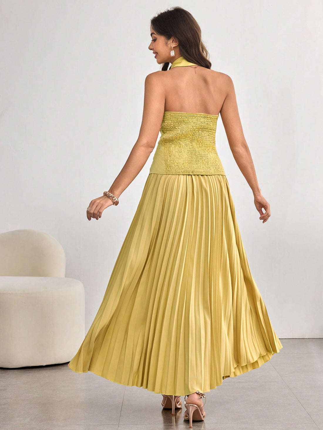 Elevate your wardrobe with this fabulous 2-piece midi skirt set that's equal parts sophisticated and fun. The cropped top features a charming neck tie collar that adds instant personality, while the shirred flare skirt creates a graceful silhouette that moves beautifully. Perfect for brunch dates, casual outings, or whenever you want to feel put-together without trying too hard. Mix, match, or wear together—this set is your new go-to for effortless style that turns heads.