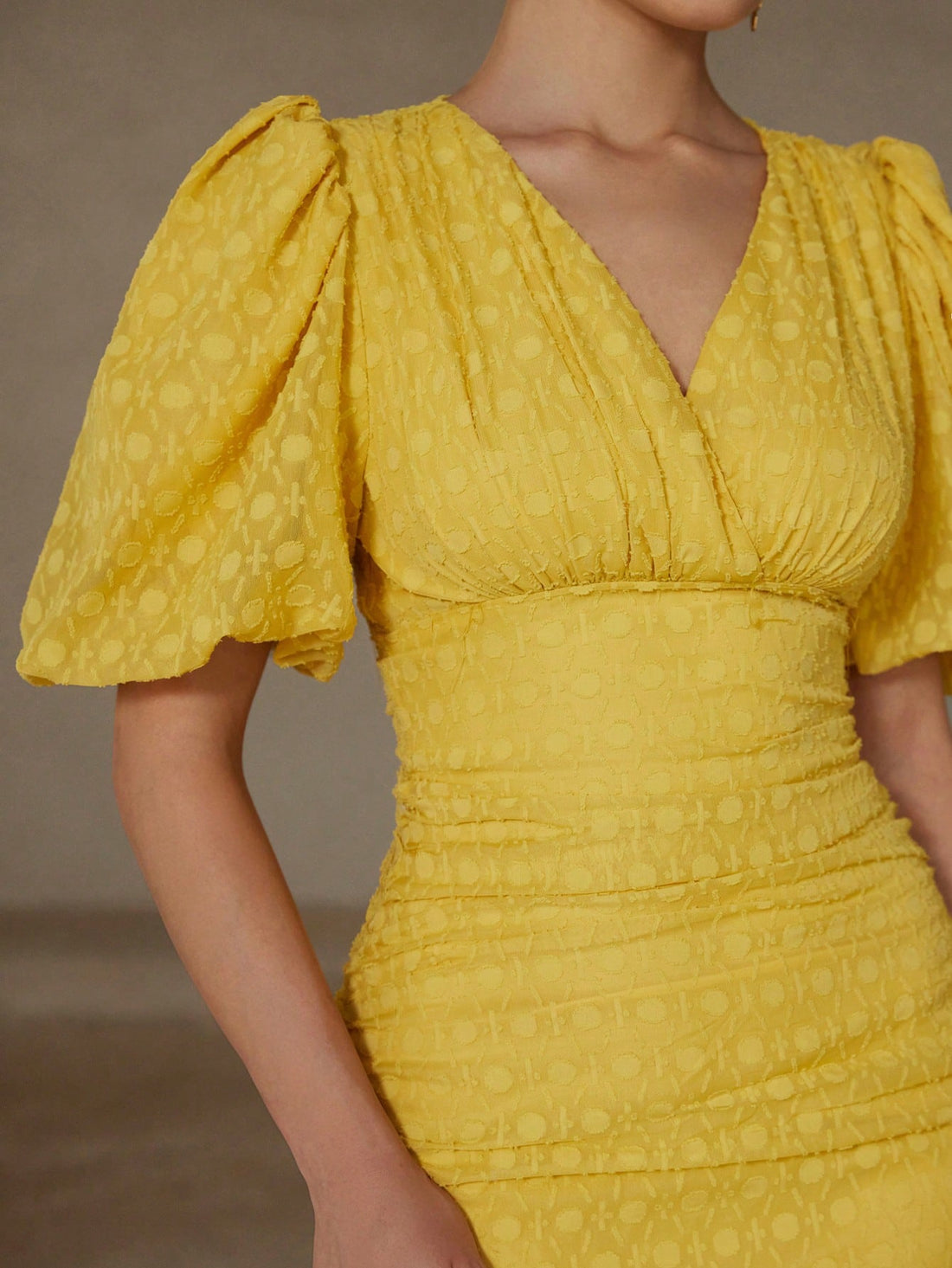 Turn heads in this stunning apricot yellow mini dress that perfectly blends elegance with fun! The flattering V-neck and delicate chiffon fabric create an effortlessly chic silhouette, while puff sleeves add a playful touch. Strategic cut-outs showcase just the right amount of skin, and the ruffle bodycon design hugs your curves in all the right ways. Whether you're heading to brunch, a night out, or a special occasion, this dress is your go-to for making a memorable impression. Dress it up with heels or ke