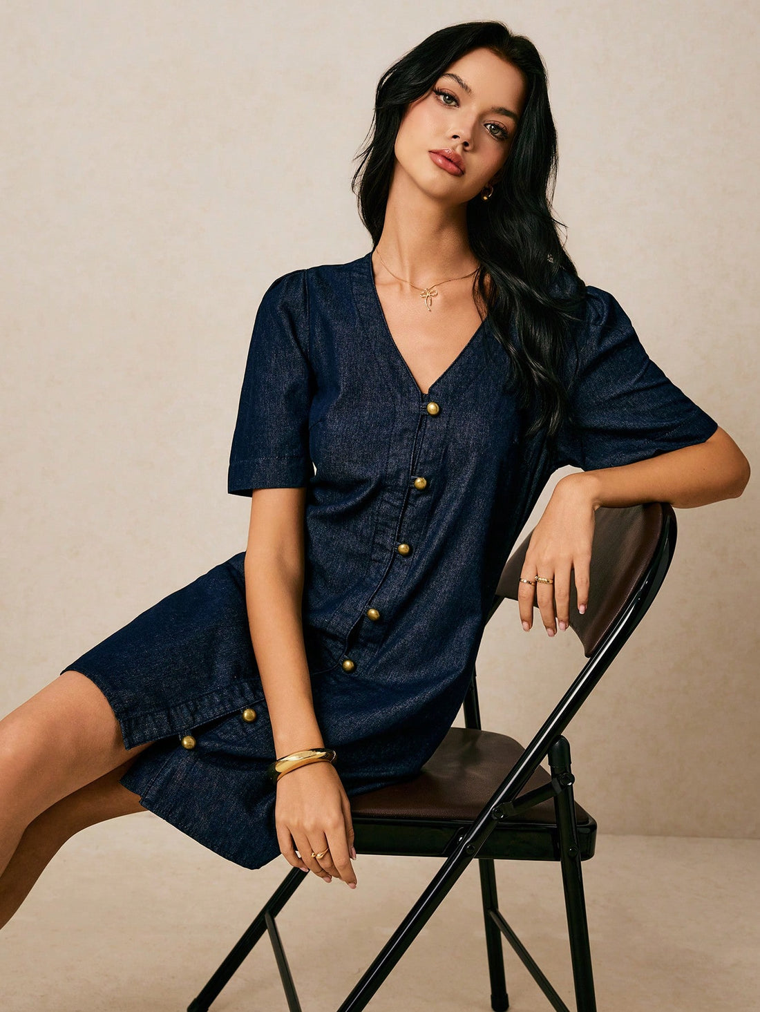 Step into summer with this playful V-neck denim midi dress, featuring charming puff sleeves that add a flirty touch. Its relaxed shift silhouette keeps you cool and comfortable all day long, while the classic blue denim brings effortless style to any casual outing. Perfect for sunny days and spontaneous adventures!