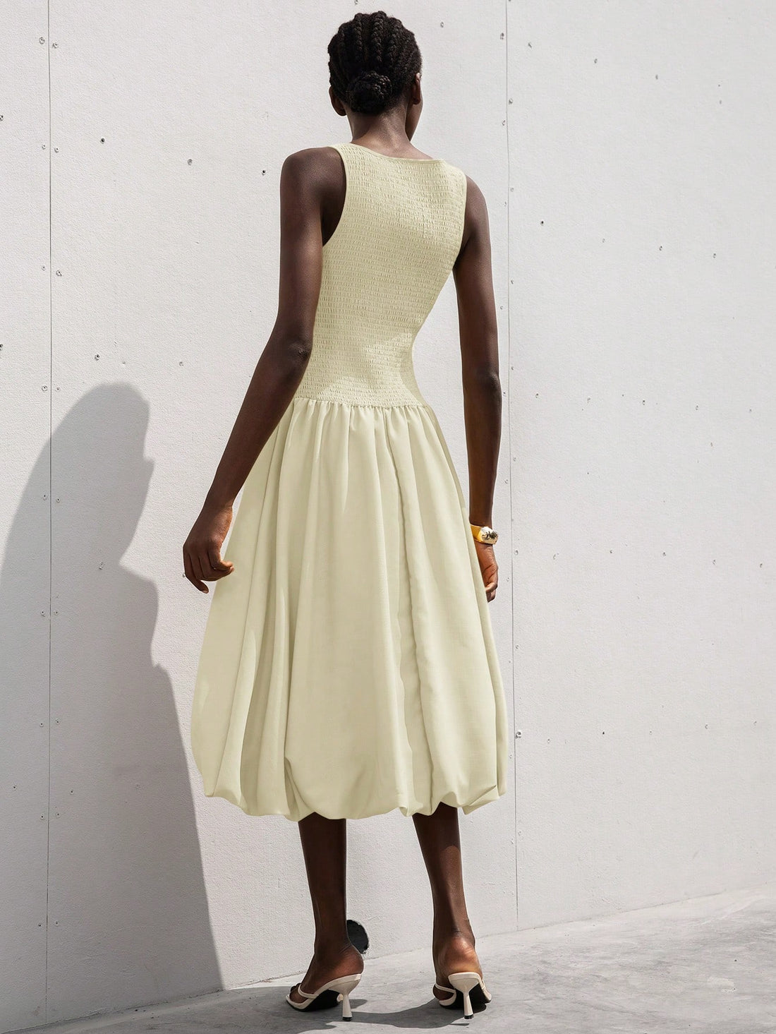 This playful sleeveless dress features a flirty ruffle hem and a drawstring waist that lets you customize your fit. Its light, breezy design makes it perfect for romantic outings or sunny days when you want to feel effortlessly charming. Add a touch of fun and femininity to your wardrobe with this delightful dress!