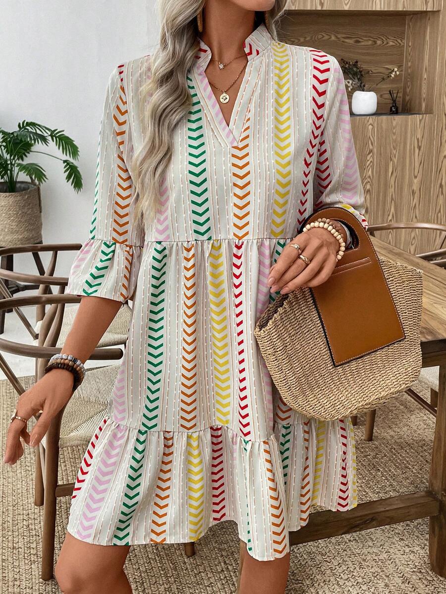 Elevate your wardrobe with this charming V-neck layered dress, designed for effortless style at any occasion. Featuring a notched neckline, flare sleeves, and a high-waisted silhouette, this piece combines comfort with contemporary flair. The striped and all-over print pattern adds visual interest, while the ruffled hem and flounce detailing create a playful, feminine touch. Crafted from a breathable polyester-elastane blend, this regular-fit dress moves with you throughout the day. Perfect for beach outing