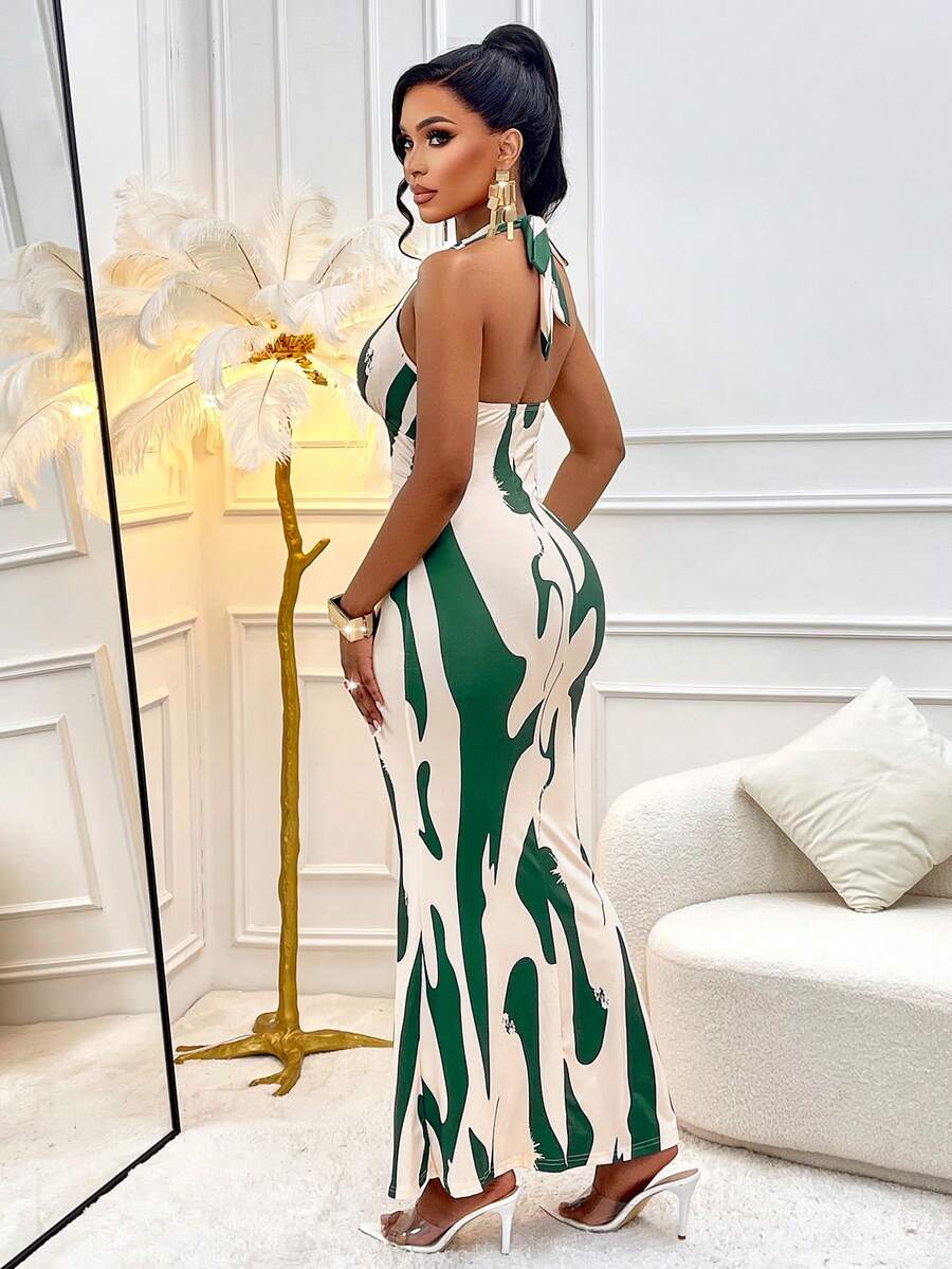 Dive into summer style with this eye-catching halterneck dress that's practically made for vacation mode. The flattering pleated waist cinches you in just right, while the charming wave pattern adds a playful coastal vibe to every outfit. Perfect for beach days, resort dinners, or anywhere you want to turn heads. Slip it on and feel the confidence—this dress does all the heavy lifting so you can focus on making memories.