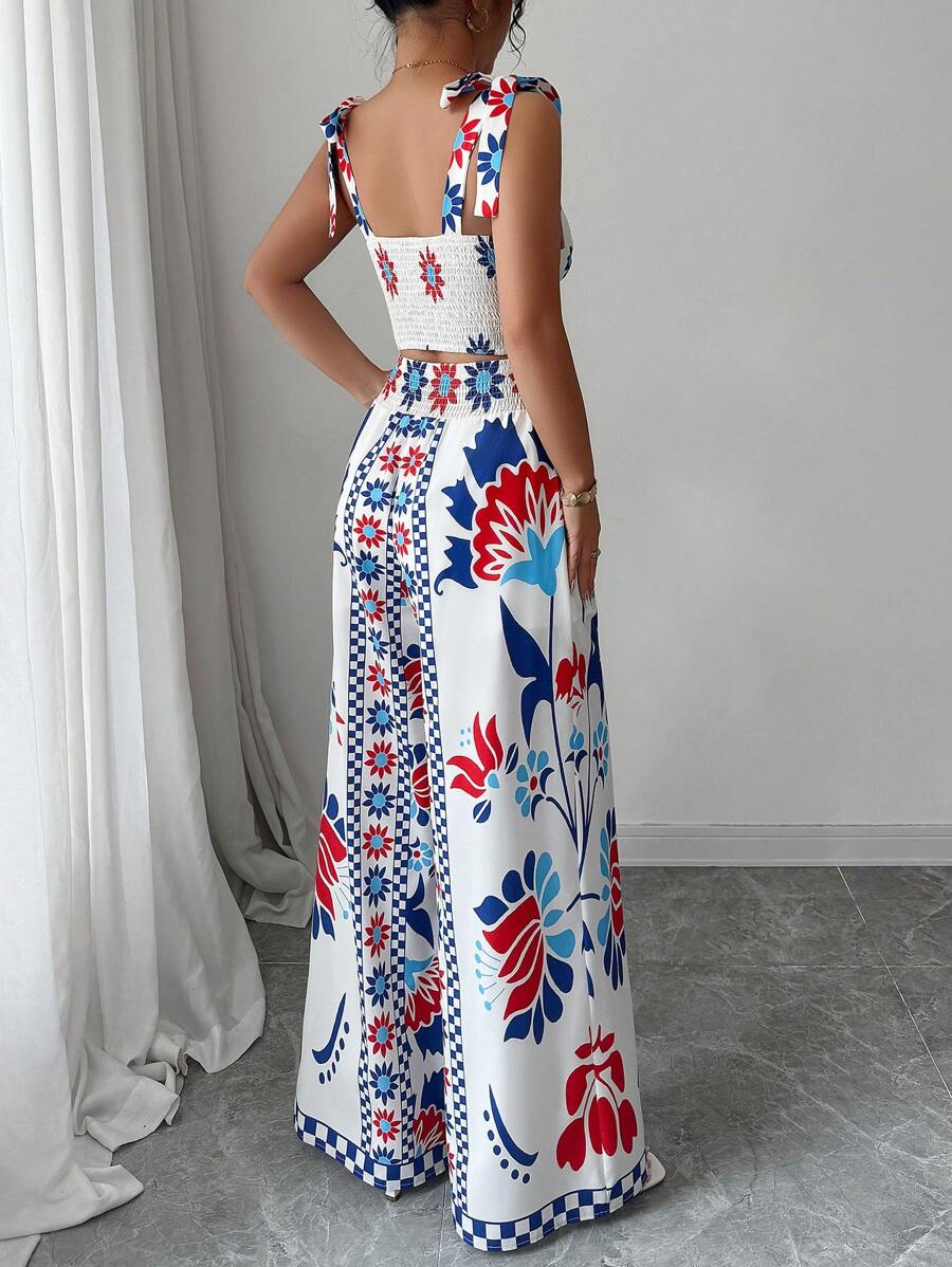 Embrace your free-spirited side with this stunning bohemian two-piece set! The delicate bowknot cami crop top pairs perfectly with flowing wide-leg printed pants, creating an effortlessly chic look that's ready for any summer adventure. Whether you're dancing at festivals, exploring new places, or simply soaking up the season, this set delivers boho vibes with a playful twist. The lightweight fabrics keep you cool and comfortable while the eye-catching prints and feminine details turn heads. Perfect for cre